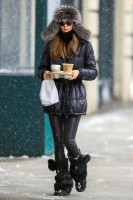 Olivia Palermo puffer jacket, leather leggings and fur pom pom boots