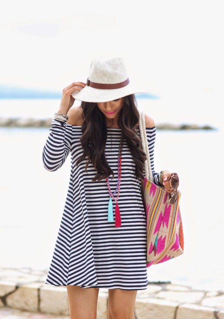 off the shoulder striped dress and hat with beach bag