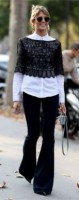 flared jeans in black with white top and black lace
