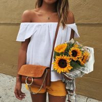 mustard shorts, white off the shoulder top, camel suede bag