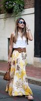 yellow floral maxi dress and white sleeveless button down shirt belted