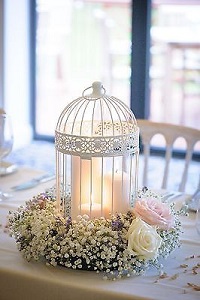 diner en blanc table decor, white birdcage with flowers