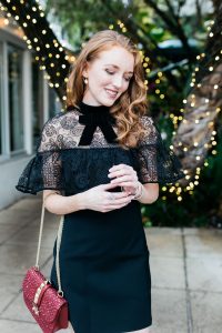Holiday outfit, black self portrait lace overlay dress with Henri Bendel red studded handbag