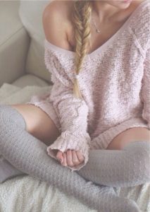 Women's holiday loungewear, knit pink sweater dress and socks