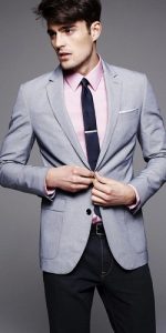 men's dark denim, light gray blazer and pale pink button down shirt with navy tie
