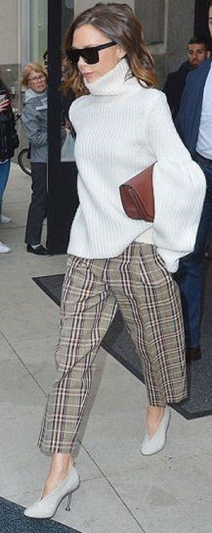 Fall prints...plaid. Victoria Beckham in plaid pants, light gray high heel booties and cream turtleneck sweater