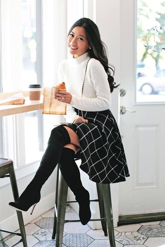 Boots at the office, black over the knee boots, black plaid skirt, and white sweater