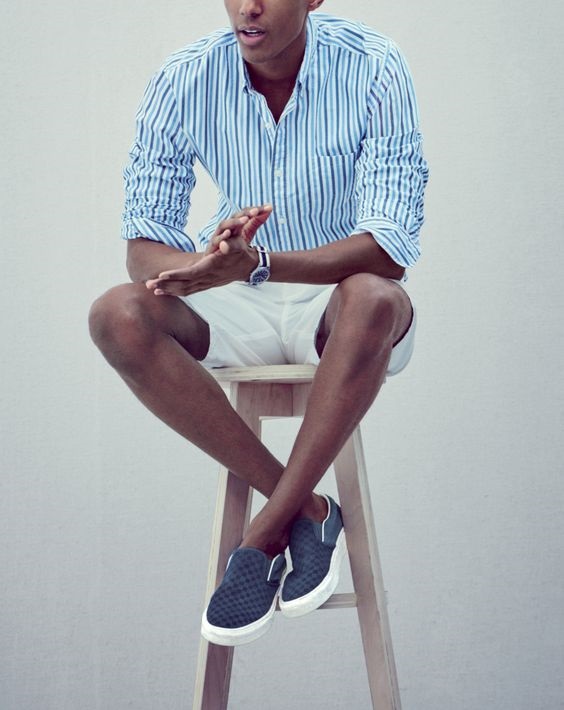 How to Stay Cool and Look Chic this Summer for Men, men's blue slip on sneakers with print button down and shorts