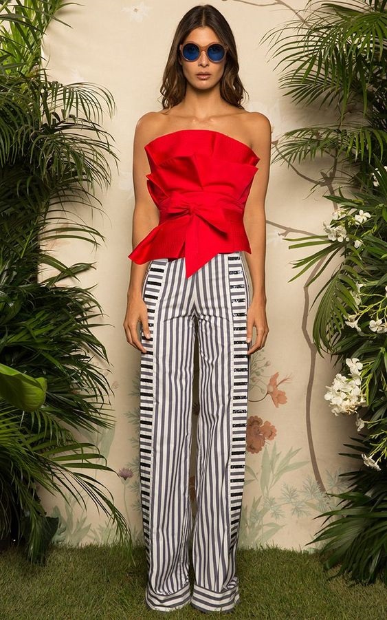 Red, White, and Beautiful Fourth of July outfits, party outfit, navy and white striped pants with red bow tie strapless top and blue sunglasses