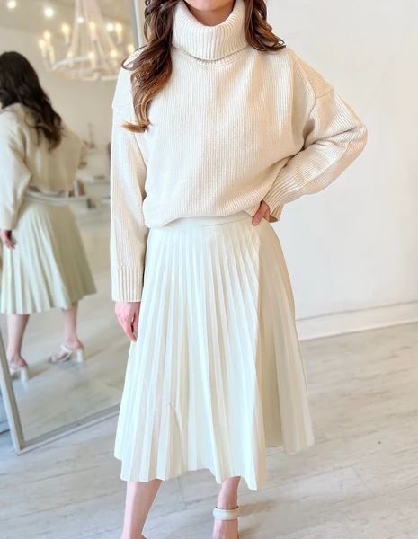 Winter Neutral Outfits with a Twist, winter neutral outfit for work, white pleat leather skirt and sweater